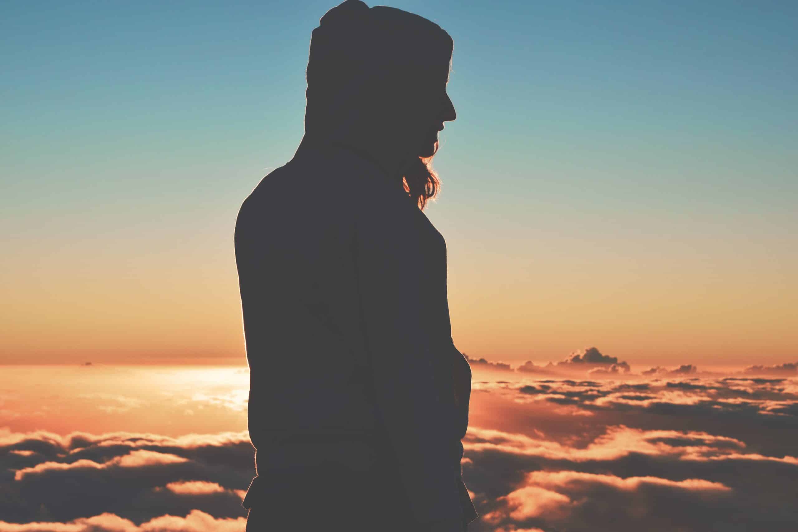 woman enjoying the sunrise | Photo by Tim Gouw on Unsplash